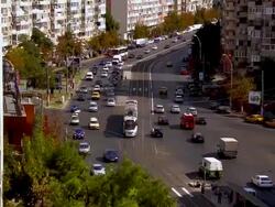MS ZO Cars and tram flowing on busy street / Bucharest, Romania Stock Footage