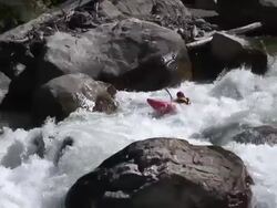 Kayaker descends extreme whitewater rapid 25fps Stock Footage