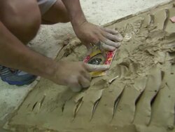 CU of man measuring the points scored during Tejo Game in rural arena, BoyacÃƒÂ¡ department, Colombia Stock Footage