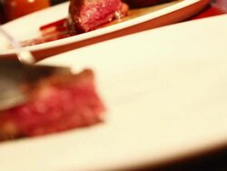 MS Preparing steak dish / Sao Paulo, Brazil Stock Footage
