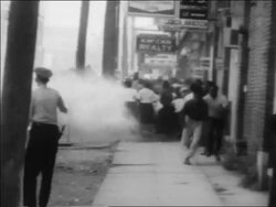 B/W 1963 authorities hosing demonstrators on sidewalk in civil rights riot / Alabama / newsreel Stock Footage