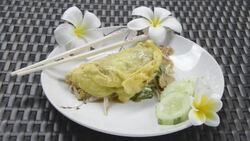 Fried noodles with chicken in omelet Stock Footage