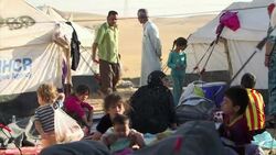 A family from Mosul treks to a neighboring refugee camp in fear of the ongoing counter assaults between militants and Iraqi government forces. (June 23) News Clip