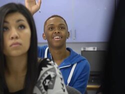 Confident Male Student Interacts in Classroom Setting Stock Footage
