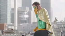 Superhero talking on phone in office Stock Footage