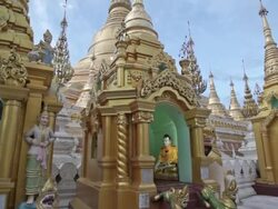 Colorful, religious statues in the Shwedagon in Yangon, Myanmar Stock Footage