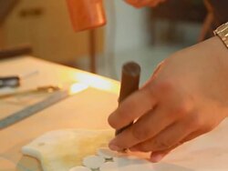 HD Dolly:Use a chisel hammer down on the white leather. Stock Footage