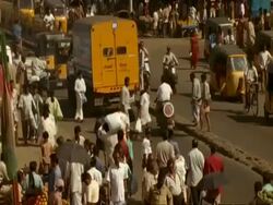 MCU High angle view of traffic and people moving through Indian city street, Madras Stock Footage