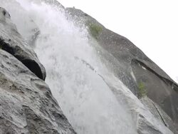 MS TD Water cascades over mountainside at Yosemite National Park / California, United States Stock Footage