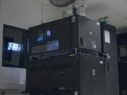MS digital cinema projector in movie theater projection booth showing standard 2D program Stock Footage