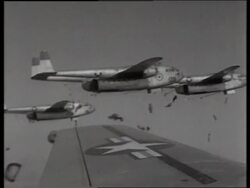 B/W 1950's airplane point of view parachutes drop from airplanes / C119 "Boxcar" / Korea / NO SOUND Stock Footage
