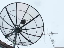 Satellite dish antenna moving in the sky Stock Footage