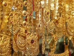 CU TU Lots of gold bangles and jewelry hanging in jewellry shop / Dubai,  United Arab Emirates Stock Footage