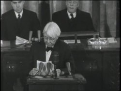 Poet Carl Sandburg reads a tribute to Abraham Lincoln in the senate chambers. News Clip