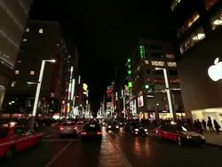 MS POV View of illumination city at night and moving traffic on road / Ginza, Tokyo, Japan Stock Footage