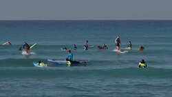 Surfers off Waikiki Beach, Hawaii News Clip