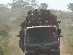An overcrowded truck on the road to the village Stock Footage