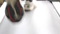 feet of man go on treadmill at large gym, running Stock Footage