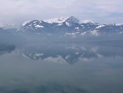 WS AERIAL View of River with fog at Buochs / Switzerland Stock Footage