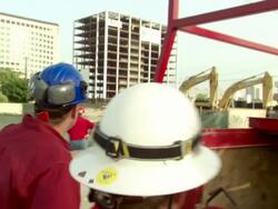 CU TU ZO MS Demolition engineers in hardhats watching demolition of building in controlled implosion with explosives / Coral Gablesh, Florida, USA Stock Footage