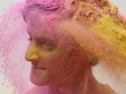 Young man playing holi festival Stock Footage