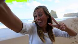 Young woman takes a selfie portrait on Gibsons steps beach Stock Footage