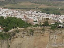 Aerial view of city with bullring and Tajo Bridge, Ronda, Andalusia, Spain Stock Footage