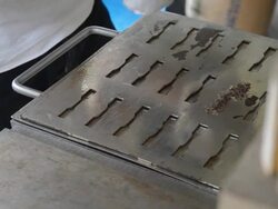 side view add polymer compound in microdogbone mold Stock Footage