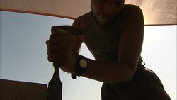 A carpenter uses a hammer to drive a chisel through wood. Stock Footage