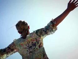 Woman spinning on beach Stock Footage
