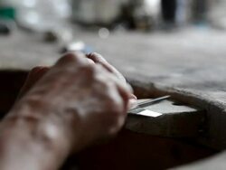 Goldsmith working on metal plate - macro Stock Footage