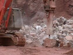 MS Stone cutter cutting stone at quarry / Taben-Rodt, Rhineland-Palatinate, Germany Stock Footage