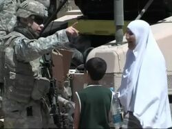 US Soldiers hand out food and Aid supplies to Iraqi civilians Stock Footage