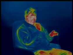 Thermographic image, MCU man sitting in armchair smokes cigarette, identical shots with info bar on DB 302 Stock Footage