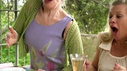 SLOW MOTION - Fun Mature Preparing Food in Kitchen. Stock Footage