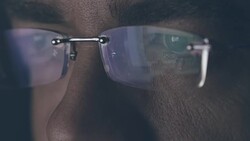 Male eyes looking at computer monitor Stock Footage