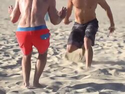 Men playing beach volleyball. Stock Footage