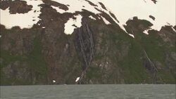 Layers of ice cover coastal mountains near the Arctic Ocean in Alaska. Stock Footage