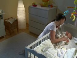 HD CRANE: Mother Stroking Her Sleepless Baby Stock Footage