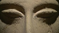 Shadows define the eyes of a pitted ceramic face in Luxor, Egypt. Stock Footage