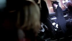 Chauffeur opens limousine door for hip-hop artist on red carpet at awards show Stock Footage