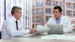Research project manager in meeting with staff scientist Stock Footage