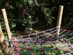 Male on fitness trail climbing Stock Footage
