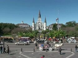 Wide Shot Zoom In - St. Louis Cathedral on bright, clear day / New Orleans Louisiana Stock Footage