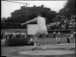 B/W 1962 Al Oerter throwing discus + setting world record / Chicago / newsreel Stock Footage