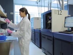 MS POV Female technician using micro-pipette at research center / Vancouver, BC, Canada Stock Footage