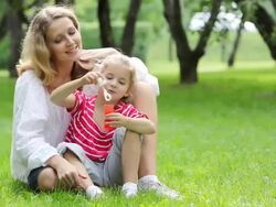 Mother and daughter having fun in park Stock Footage