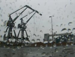 WS LA Crane towers are demolished using explosives and collapse into  shipping canal / Liverpool, NorthWest England, UK Stock Footage