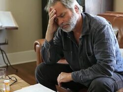 Man overwhelmed with medical bills Stock Footage
