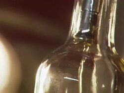 Close up of bottles being filled with rum. Stock Footage